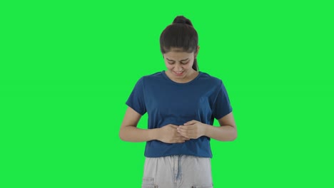 Indian-teenage-girl-having-stomach-pain-Green-screen