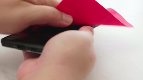 people cleaning and disinfecting mobile smartphones