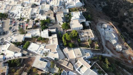 drone view in greece top view over a greek white house town with white rooftops on a brown mountain