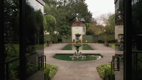 exiting a lunch room to a beautiful fountain at the houmas house and garden in darrow