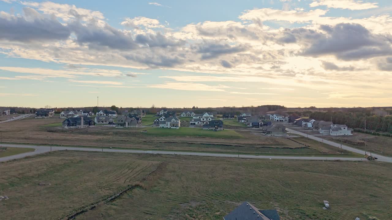 Aerial Flyover Of Houses In A New Home Construction Development At Sunset In Caledon, Ontario, Canada