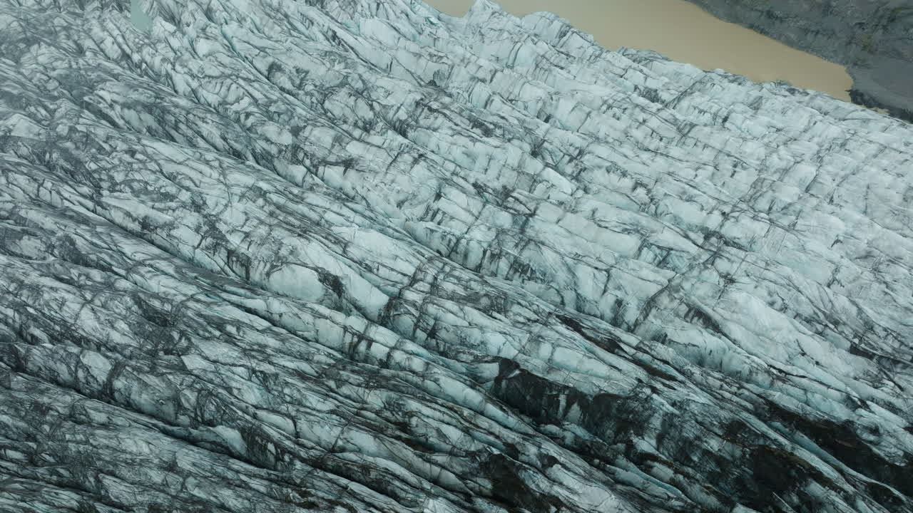 Aerial drone footage of Svínafellsjökull Glacier in Iceland, showcasing its stunning ice formations. Part 5.