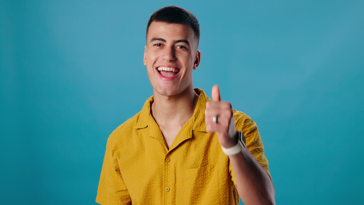 A happy man gives a thumbs up