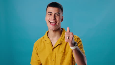 a happy man gives a thumbs up