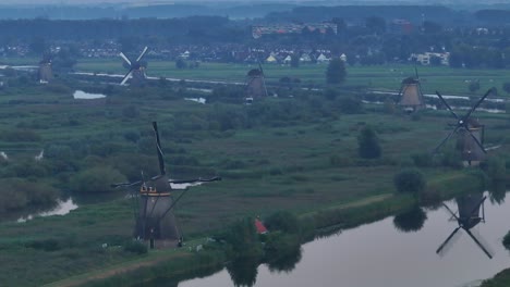 windmills in aerial view among irrigated fields