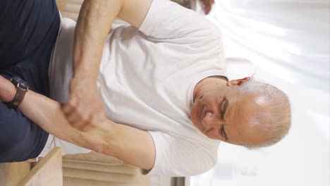 Vertical-video-of-Old-man-with-itchy-arms.