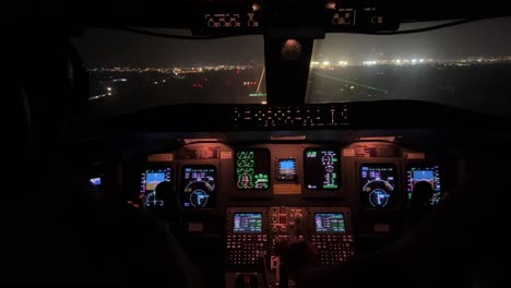 exlusuve night view of a jet cockpit during a real night landing