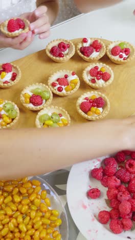 preparing fruit tarts