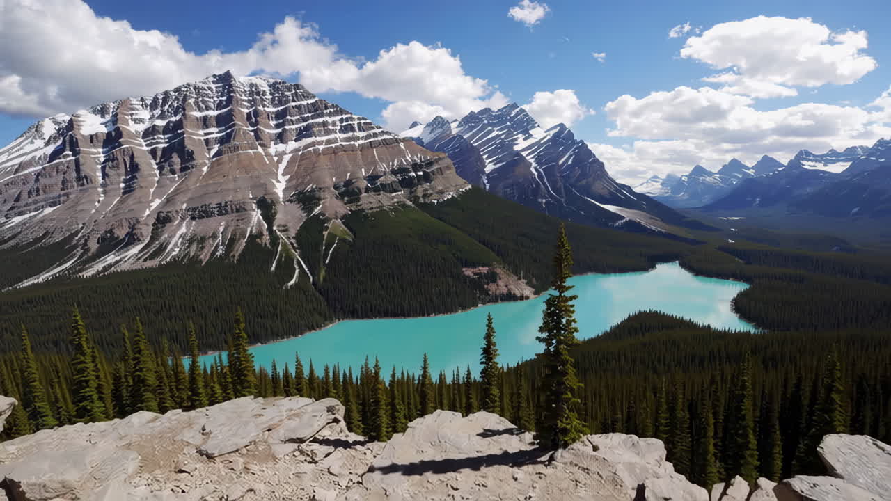 Woman enjoying the view of a turquoise lake in the Canadian Rockies