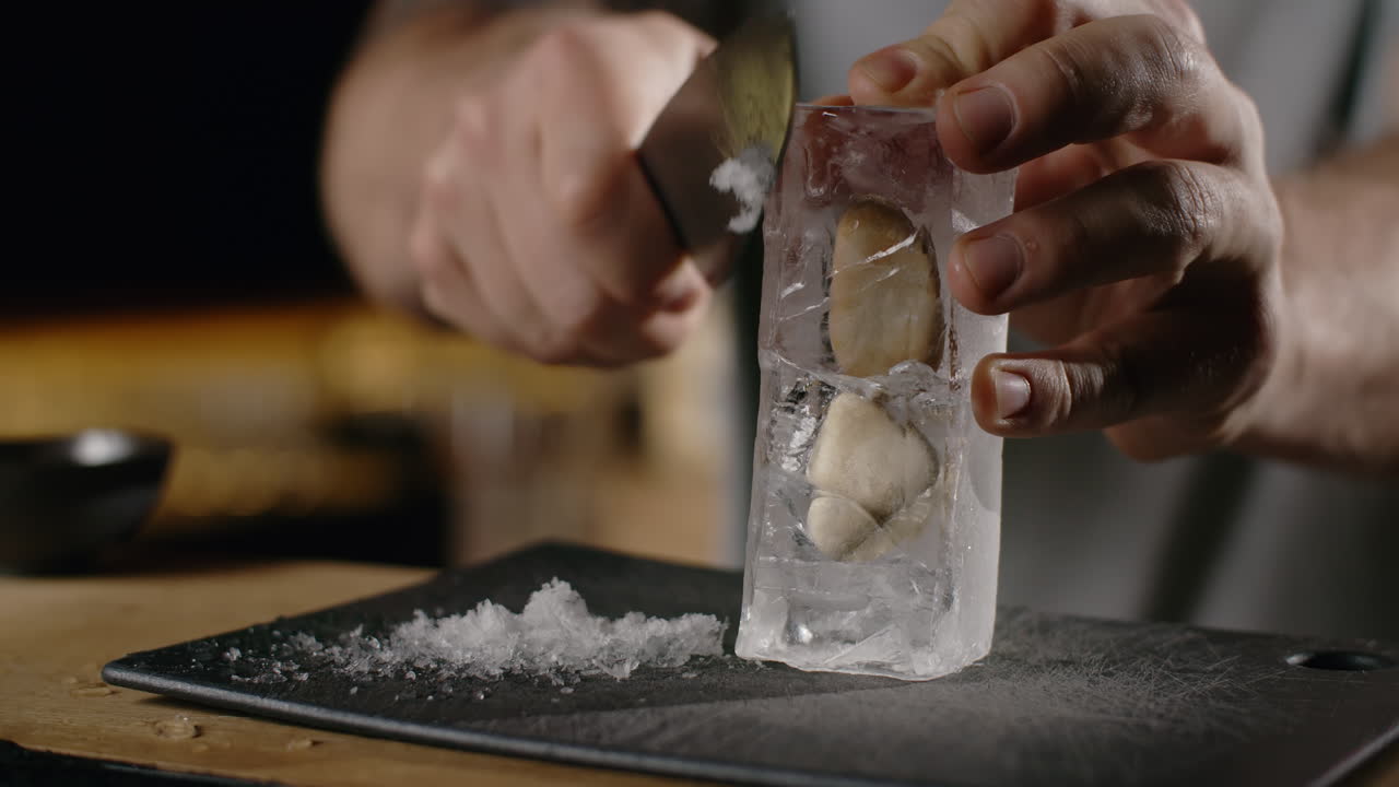 Chef preparing ice cubes with oysters