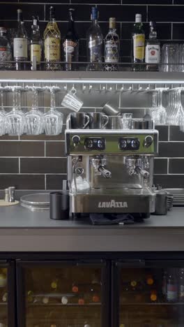 bar setup with lavazza espresso machine and liquor bottles