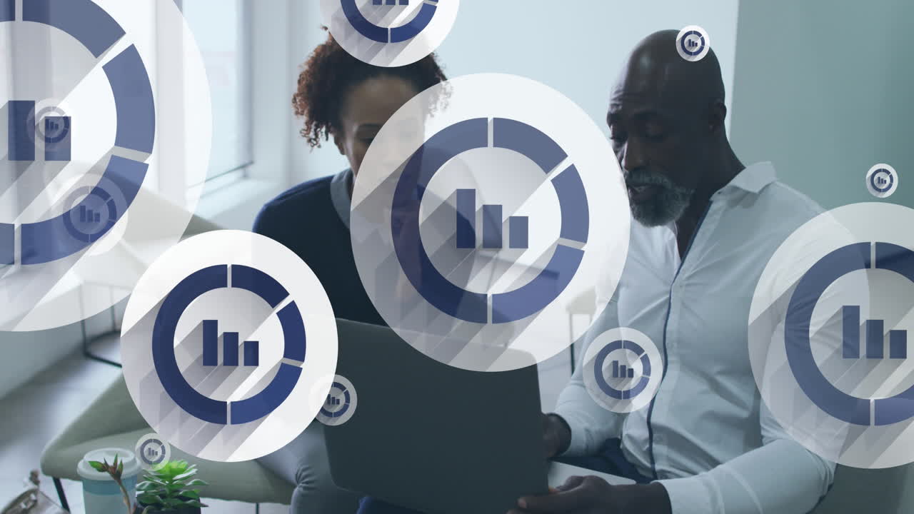 Animation of digital icons over diverse business people in office