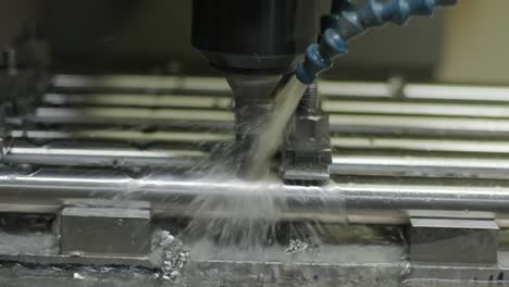 cnc milling machine drills holes in the pipe.