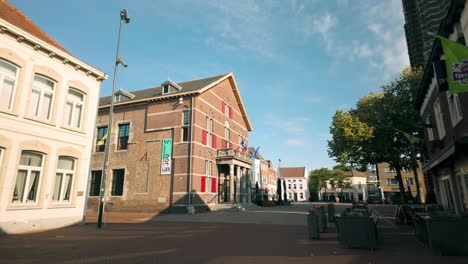 smooth glide through weert's quiet, historic city center on a clear day, showcasing charming dutch architecture and peaceful streets. location: weert, limburg, netherlands