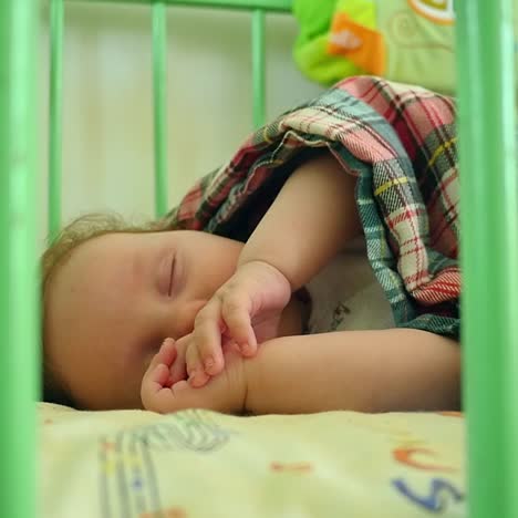 newborn child in crib