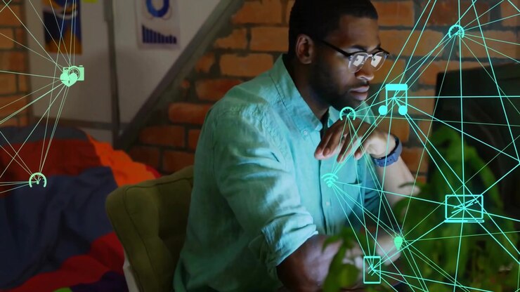Graphic designer working at desk in cozy tech workspace, showing laptop wifi icons floating