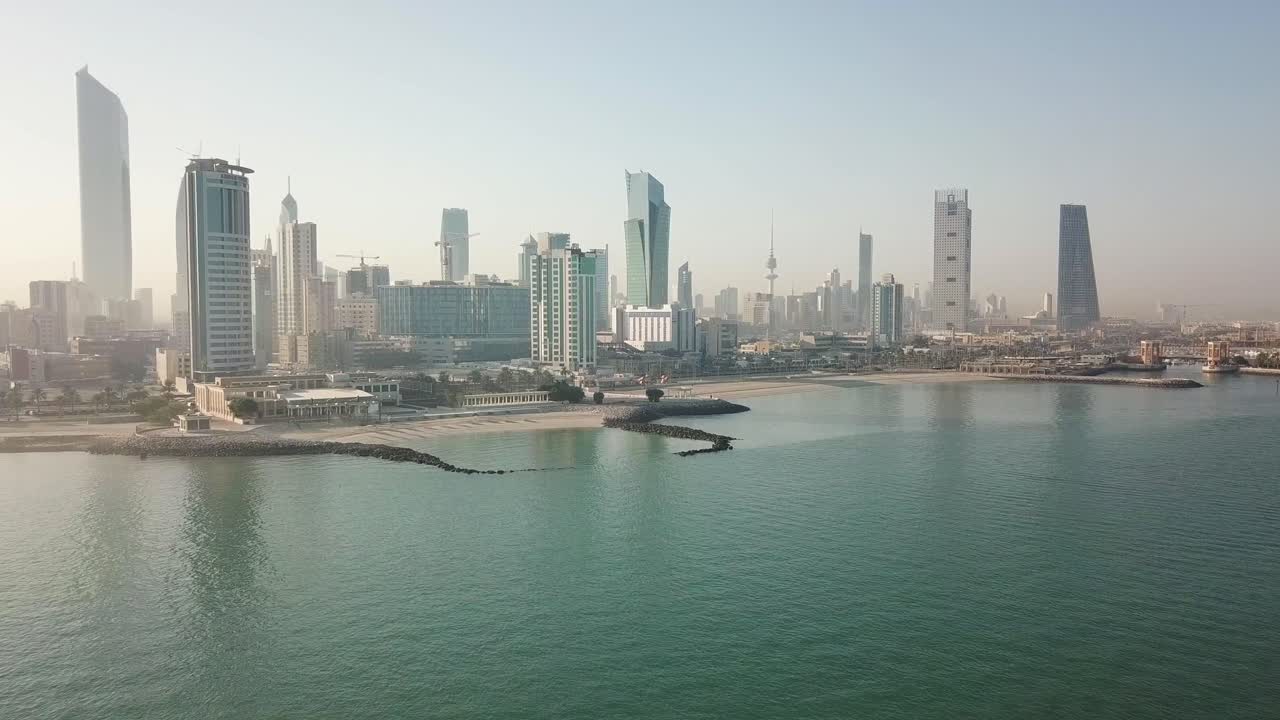 Panoramic Aerial Footage of Kuwait City Skyline. Arabian - Persian Gulf Sea. Forward Dolly Shot