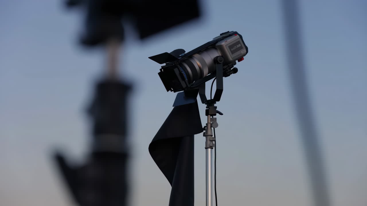 Professional Video Camera with Black Flag on Tripod
