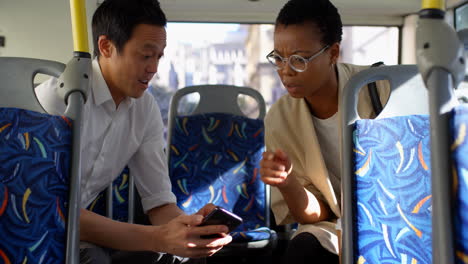 commuters using mobile while travelling in bus 4k