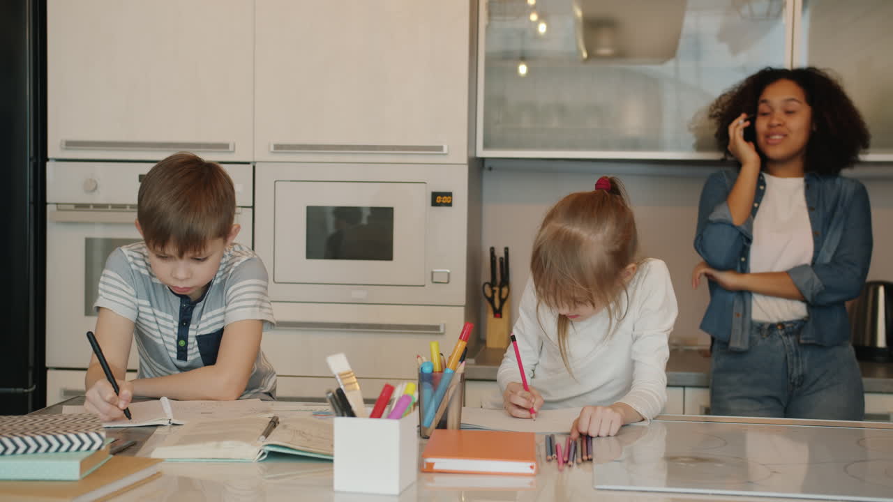 Children Doing Homework in a Kitchen