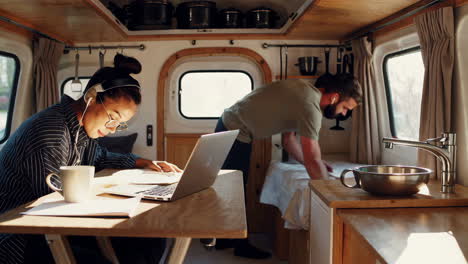 couple working and living in a converted camper van