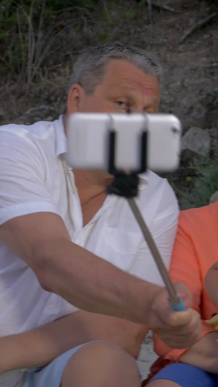 Family selfie with grandparents and grandson