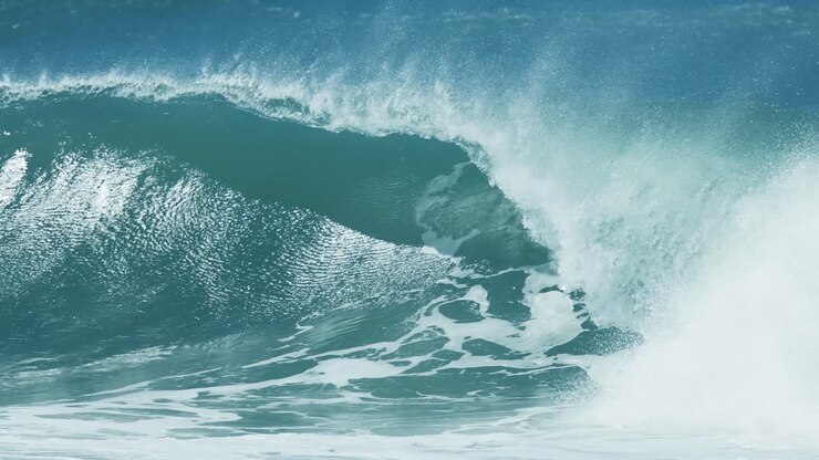Large barrel wave breaking in rough Pacific Ocean waters