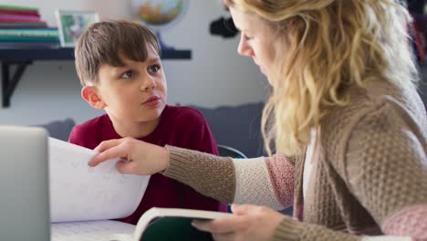 video of boy learning with his mother at home