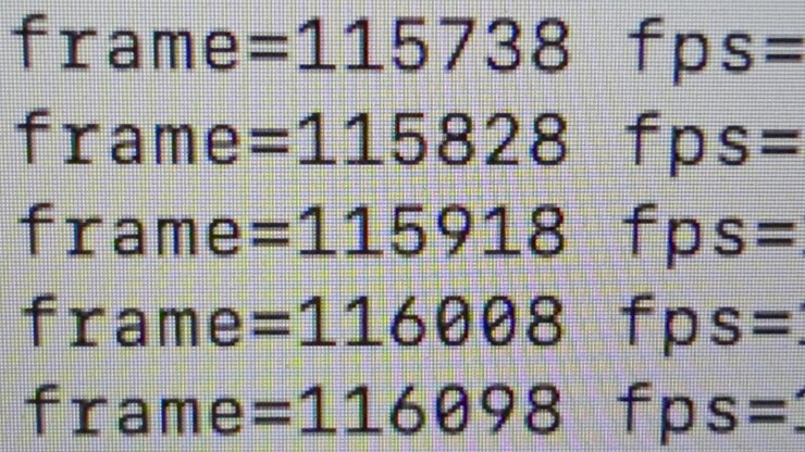 Close-up of a video encoding process showing rapidly changing frame numbers and FPS data on a computer screen, representing digital media processing, transcoding and video production technology.