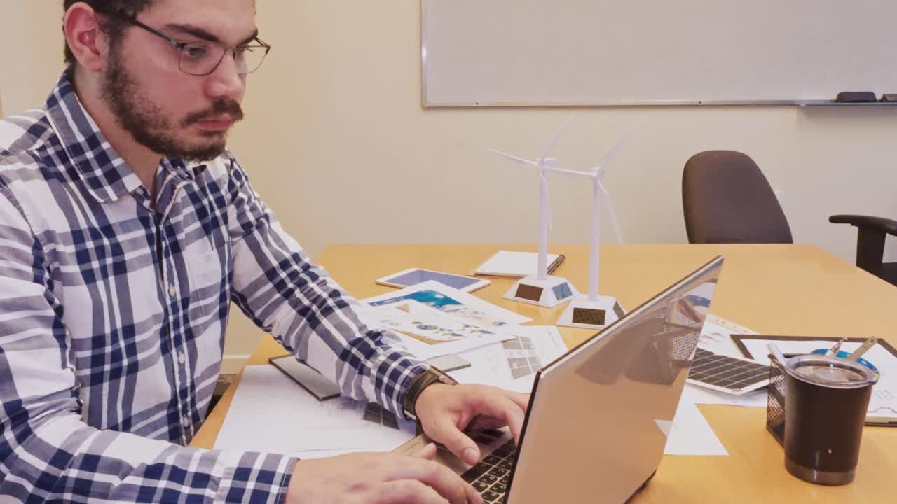 Close-Up of Engineer's Hands Typing on Laptop Keyboard