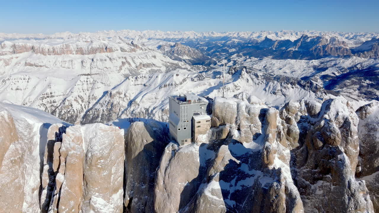Aerial drone view of the Marmolada mountain in the Dolomites, northeastern Italy with the blue sky on the background