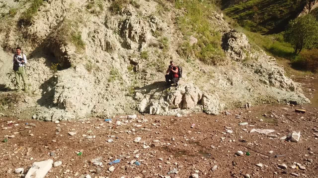 photographer capturing the beauty of mountains and lakes, I also collect waste, highlighting the danger of pollution and its harmful effects on ecosystems and marine life garbage collect activity iran