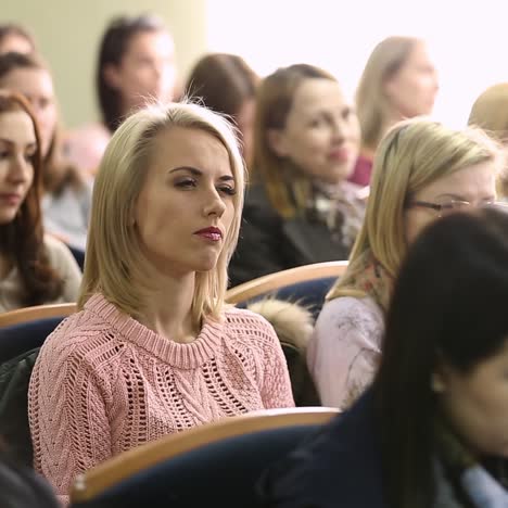 audience listens in a conference hall
