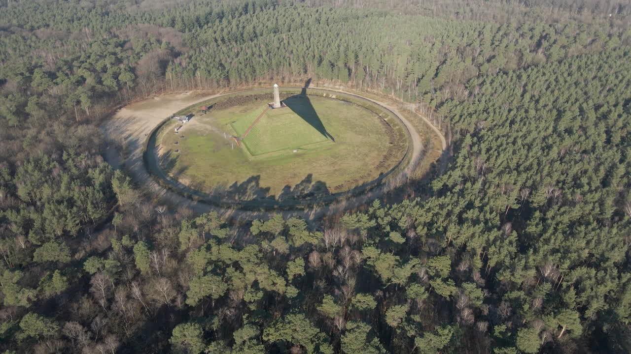 Wide Aerial of Austerlitz Pyramid surrounded by a beautiful forest. The Piramide van Austerlitz is a monument in the Netherlands, built in 1804 as a tribute to Napoleon Bonaparte.
