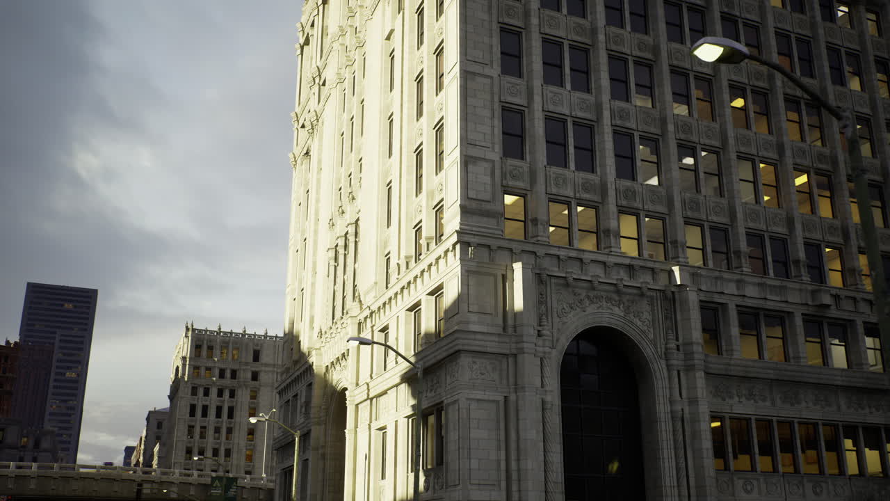 Urban architecture reflects golden light in a bustling city landscape