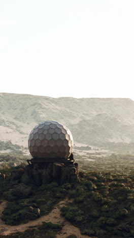 futuristic geodesic dome on a remote mountaintop