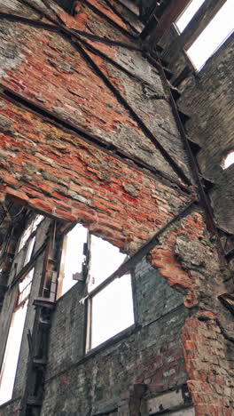 interior of abandoned factory. ruins of very heavily polluted industrial factory vertical video
