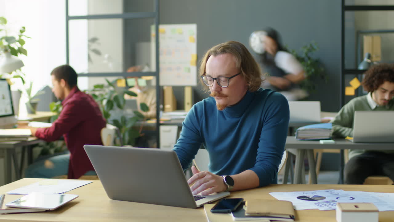 Timelapse of Man Overloaded with Work in Office
