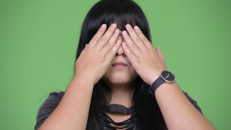 beautiful overweight asian woman covering eyes as three wise monkeys concept