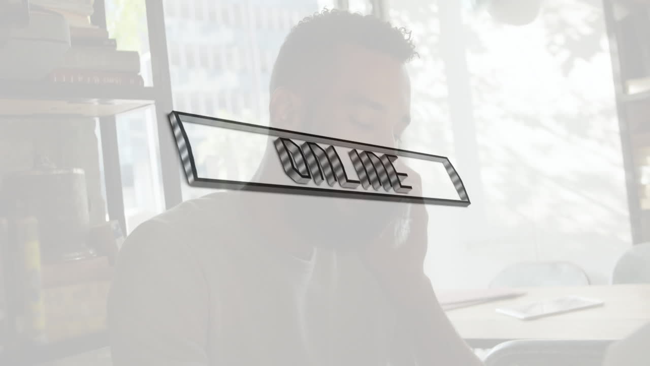 Online text animation over person working at desk near large window