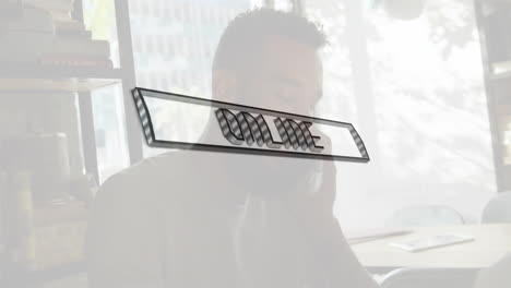 online text animation over person working at desk near large window