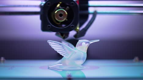 3d printing process of a hummingbird figurine: captivating journey from initial layers to final touches in a vibrant color spectrum