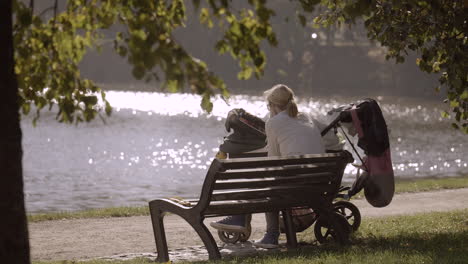 mother with her baby relaxing in a city park.