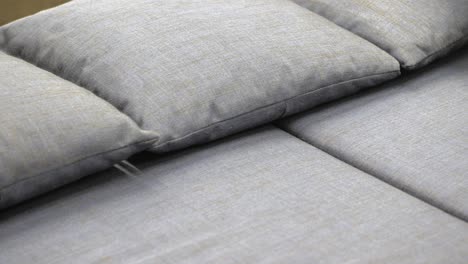 close-up of gray fabric sofa cushions