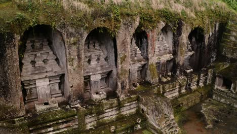 shrines cut into cliff niches at historic kawi sebatu temple in ubud