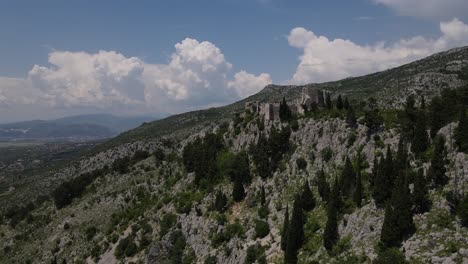 An-aerial-view-shows-the-Blagaj-Fortress-and-the-village-it-overlooks-in-Mostar,-Bosnia