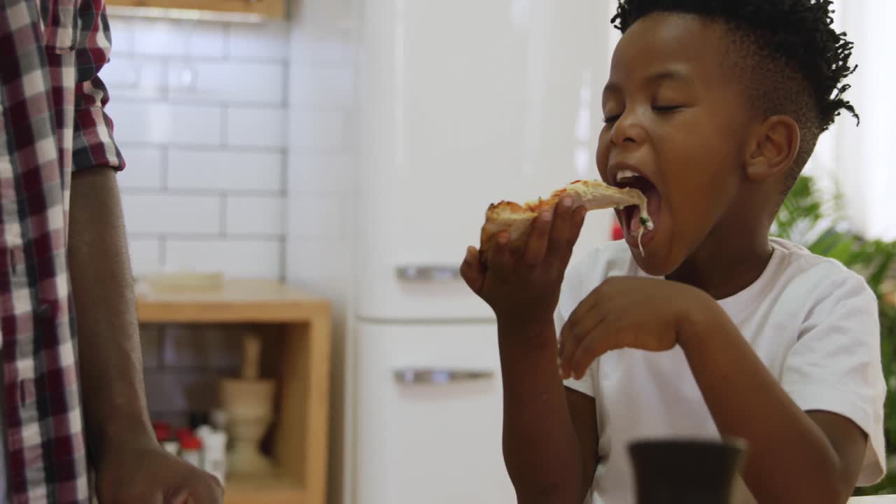 Father and son cooking together