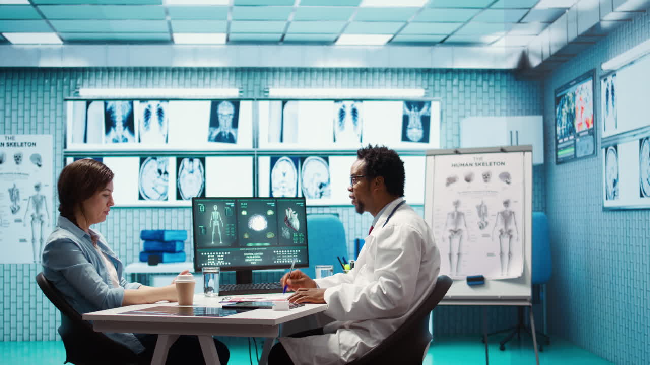 Male physician doing x ray diagnostics scan interpretation during check up visit
