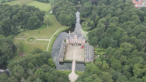 Aerial-view-of-beautiful-classic-castle-with-green-garden