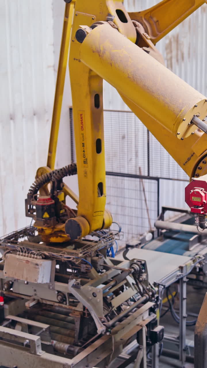 Innovative factory background. Robotic equipment inside the plant. Manufacturing production. Industrial machine. Vertical video